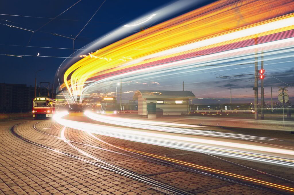Public transportation at night. Lights of the tram in motion. Prague, Czech Republic